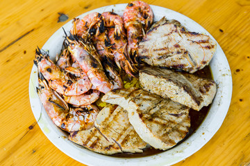Shrimp and tuna fillet on a plate
