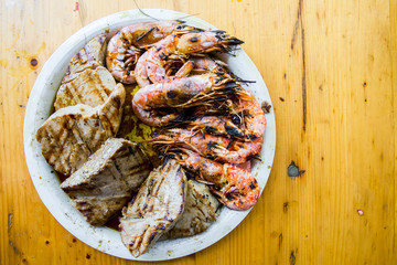 Shrimp and tuna fillet on a plate