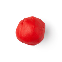 red piece of plastic on a white background