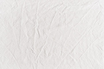 Fototapeta na wymiar White cotton canvas fabric texture with creases.