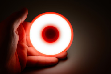 Person playing with spinner in the dark