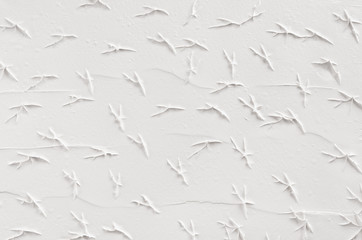 White decorative abstract plaster texture with cracks, splash, footprints.