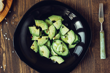 Top view of vegetarian avocado salad.