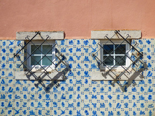 Facade of a Portuguese house decorated with vintage Portuguese tiles (azulejos)