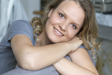 Closeup of beutiful yound blonde woman. Smiling woman face