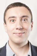 Obraz premium Portrait of a happy smiling businessman, isolated on a white background