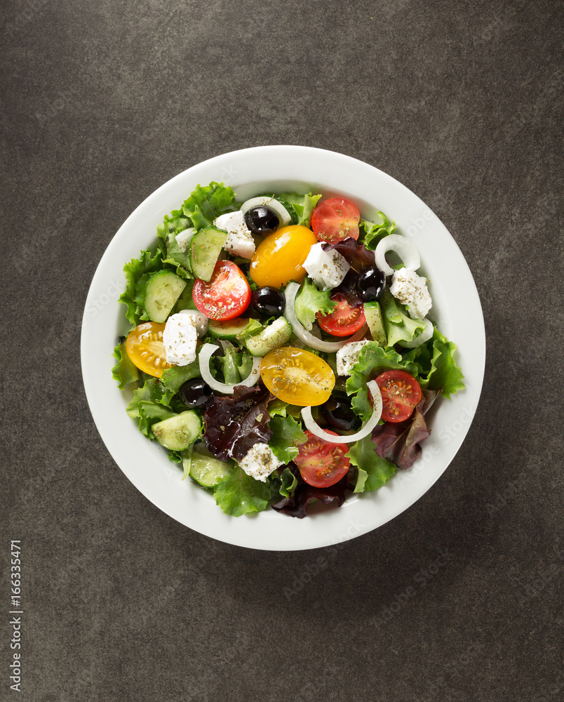 Poster fresh greek salad in plate