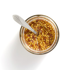 mustard sauce in plate on white background