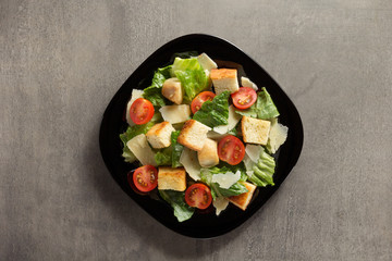 caesar salad in plate at table