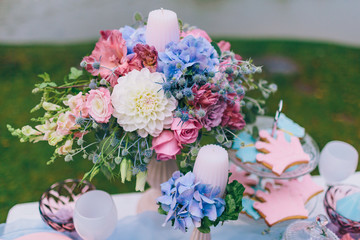 Wedding decoration in the style of boho, floral arrangement, decorated table in the garden. Bridal bouquet