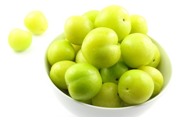 fresh turkish can erik plum fruits in a small white bowl