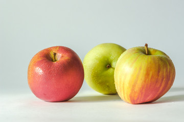 3 apples on white background