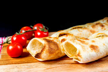 Mexican fajita wraps with grilled chicken fillet and fresh vegetables