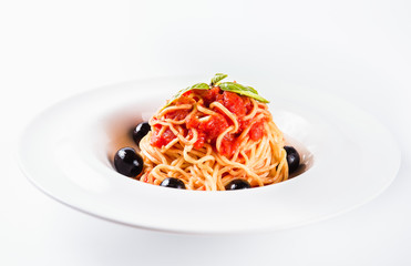 Pasta with tomatoes, garlic, olives and tomato sauce (close)