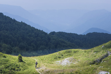 Fototapeta na wymiar Moutain biker descending from Mozic hill, near Soriska planina.