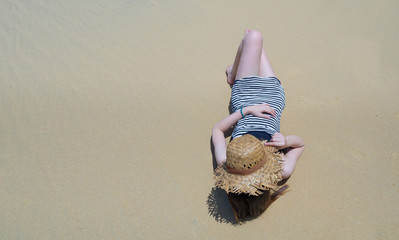 portrait of woman relaxing on the beach.