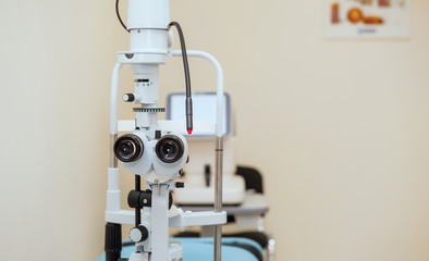 Slit lamp. Biomicroscope. Binoculars. Ophthalmic equipment.. Close up, selective focus. Health care concept. Space for text.