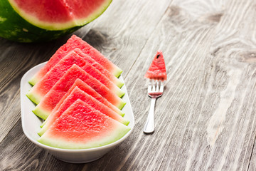 Watermelon on wooden background.