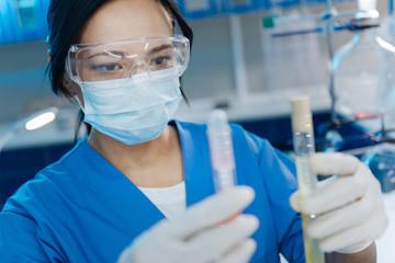 Smart pleasant woman working in the medical lab