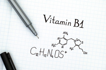 Chemical formula of Vitamin B1 with black pen