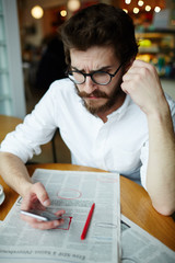 Job hunting man searching for employer of suitable vacancy contacts