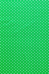 Green polka-dot cotton print top view