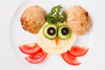 Children's complex lunch owlish (mashed potatoes, cutlet, vegetables). Top view close