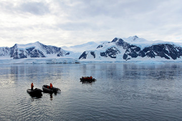Inflatable boat full of tourists, watching for whales and seals, Antarctic Peninsula, Antarctica