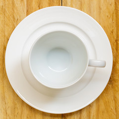 Empty coffee cup or tea cup on the wooden table, Top view.