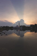 Fototapeta na wymiar Rays of light was captured during sunset at a mosque.