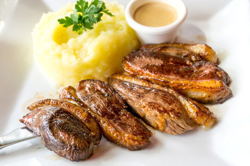 juicy steak beef meat with tomato and potatoes