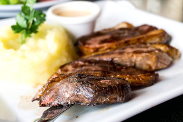 juicy steak beef meat with tomato and potatoes