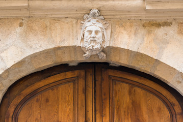 Naklejka premium Paris, beautiful wooden massive door, girder with sculptures 