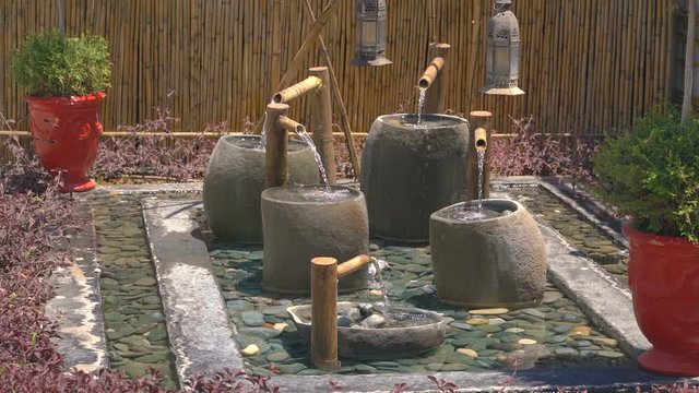 tSmall asian garden with raditional fountain