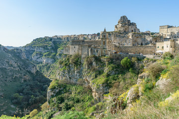 Fototapeta premium ancient ghost town of Matera (Sassi di Matera) in beautiful sun shine with blue sky, southern Italy