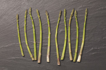 Fresh apaparagus on a rustic slate background