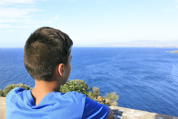 Boy seeing the blue sea