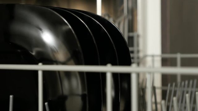 Drawer of dish washing machine close-up footage - Dishware arranging inside sliding rack  video