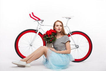Girl with flowers and bicycle