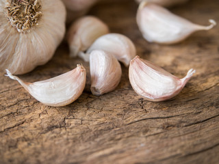 Garlic cloves on wood table.