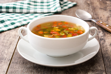 Vegetable soup in bowl on wooden table

