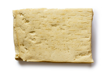 Single block of white tofu isolated on white from above.