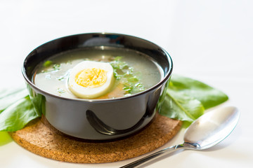 A fresh green soup with spinach sorrel egg potato