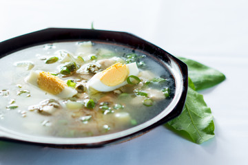 A fresh green soup with spinach sorrel egg potato