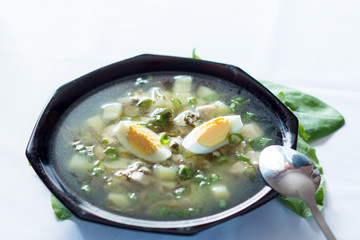 A fresh green soup with spinach sorrel egg potato