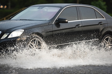 car rain puddle splashing water