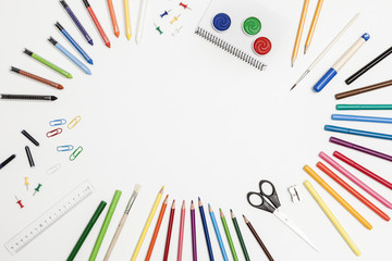 colorful school accessories on a white background