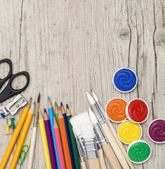 school accessories on a light wooden background