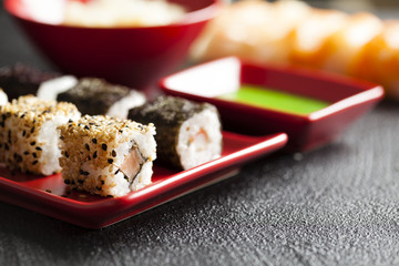 Sushi food on red plate and wasabi