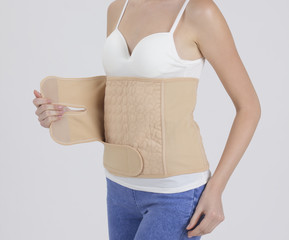 Mother wearing obsterical support belt